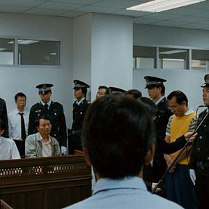 Foto Killing the Chickens to Scare the Monkeys