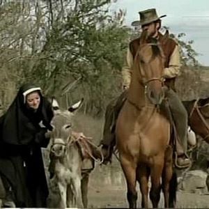 Foto Dos mulas y una mujer