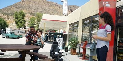 Cartel de W-E-- WE'RE B-A-- BACK!